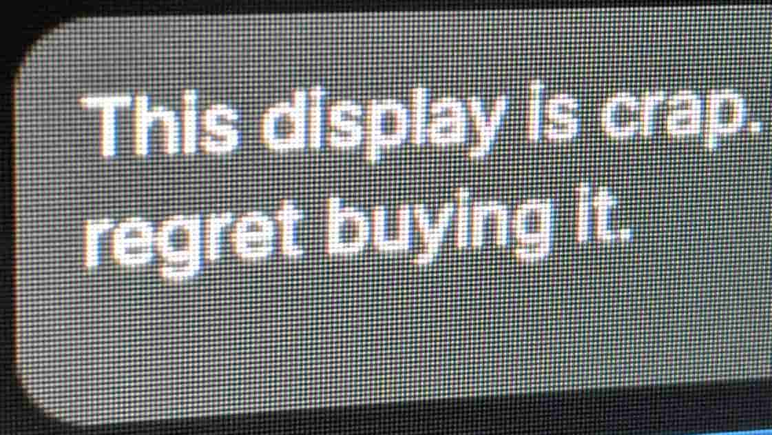 Text reads "this display is crap, regret buying it" with an overly large pixel pitch