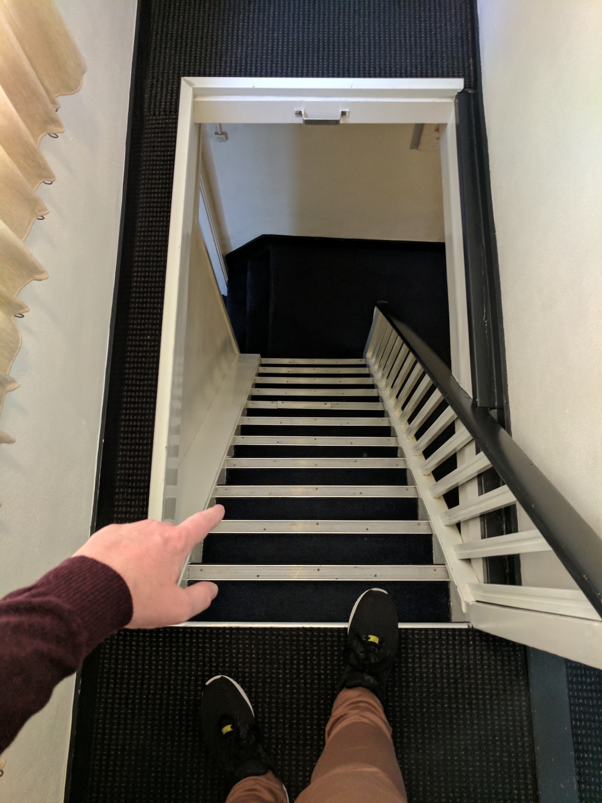 Looking down the staircase at my hotel. If it wasn't bolted down I'd call it a ladder.
