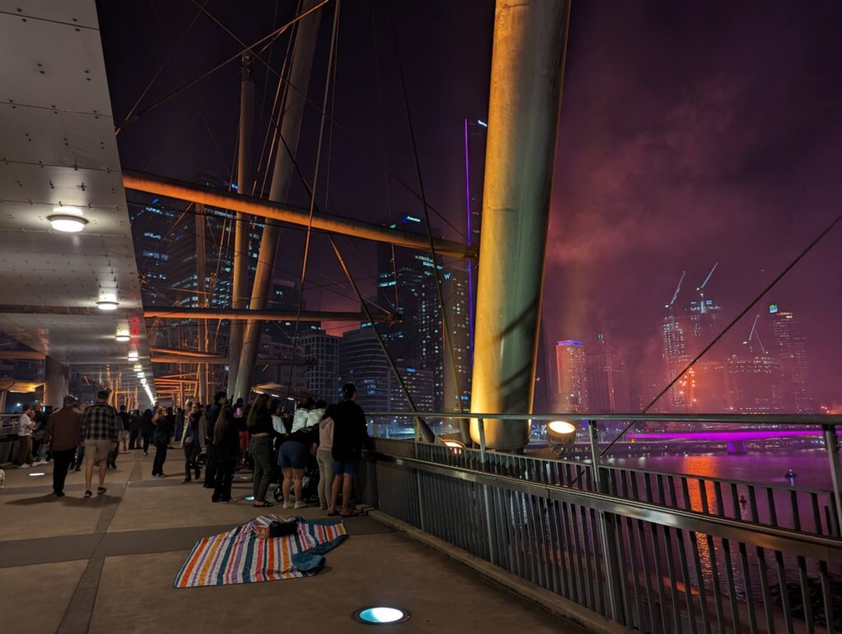 The crows on the Kurilpa Bridge. Someone brought a picnic mat, but quickly abandoned it to stand by the railing.