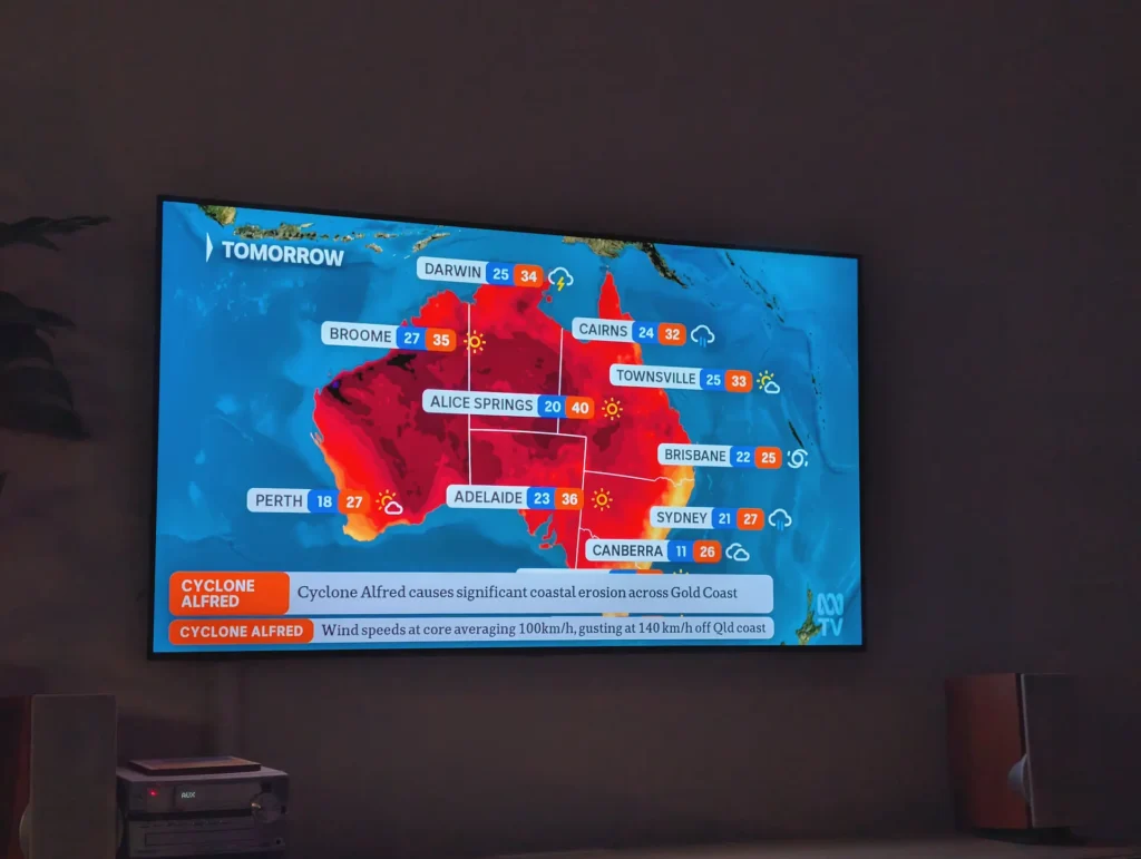 The TV shows Alice Springs sunny with a top of 40, Brisbane a top of 25 and a cyclone.